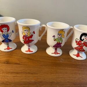 Set of 4 Vintage-Style Pedestal Egg Cups with Colorful Doll Illustrations